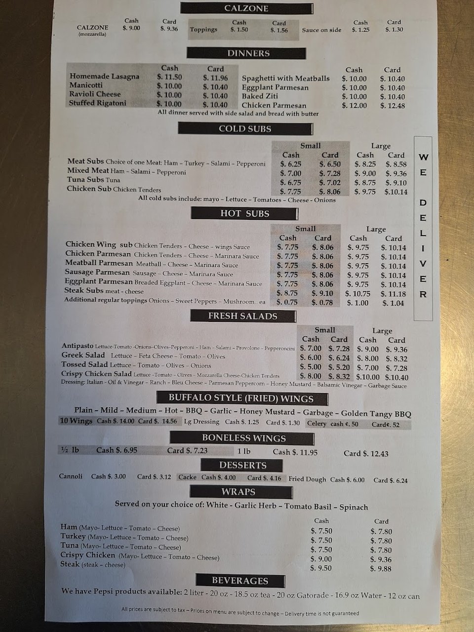 Printed menu beside a pizza restaurant setting.
